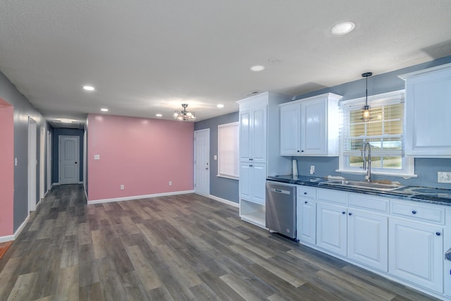 kitchen featuring sink, decorative light fixtures, white cabinets, stainless steel dishwasher, and dark hardwood / wood-style floors