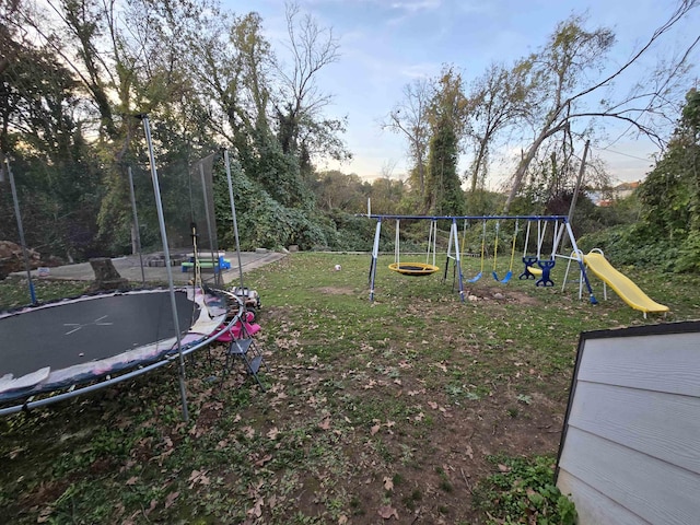 view of play area with a lawn and a trampoline