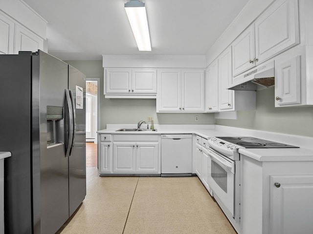 kitchen featuring white appliances, baseboard heating, white cabinetry, and sink