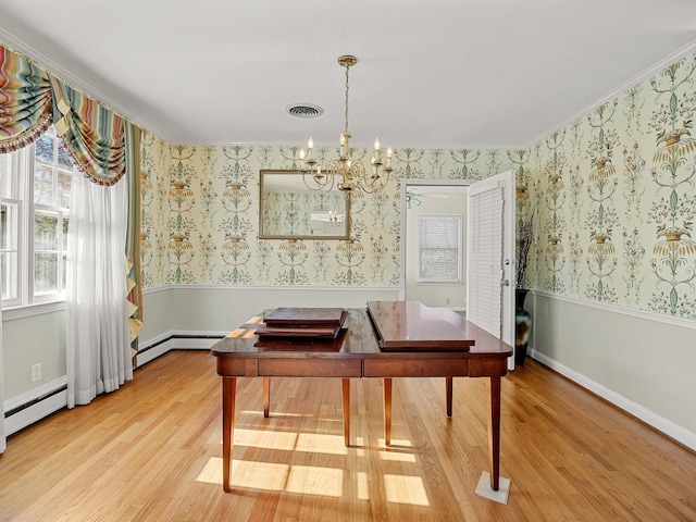 dining area with ceiling fan with notable chandelier, wood-type flooring, and ornamental molding