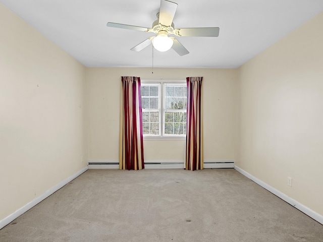 carpeted empty room featuring ceiling fan and a baseboard radiator