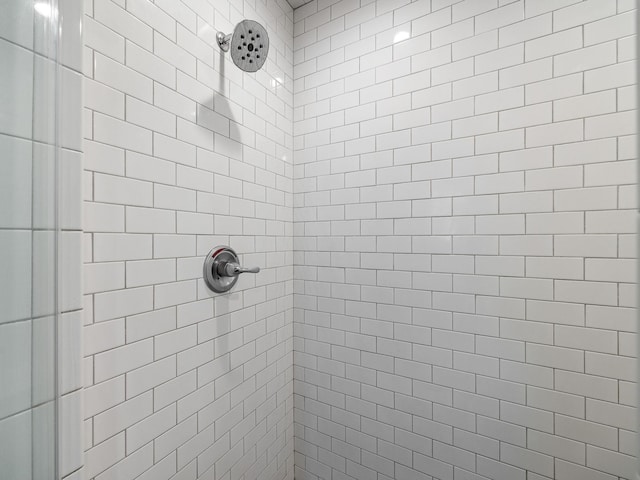 bathroom with a tile shower