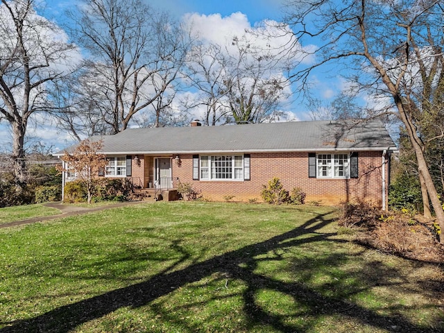 ranch-style home featuring a front yard