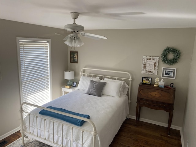 bedroom featuring dark wood-type flooring and ceiling fan