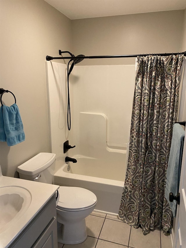 full bathroom featuring toilet, tile patterned flooring, shower / bath combo with shower curtain, and vanity