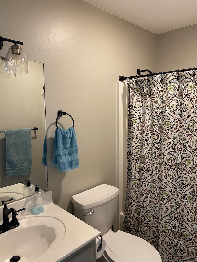 bathroom with toilet and vanity