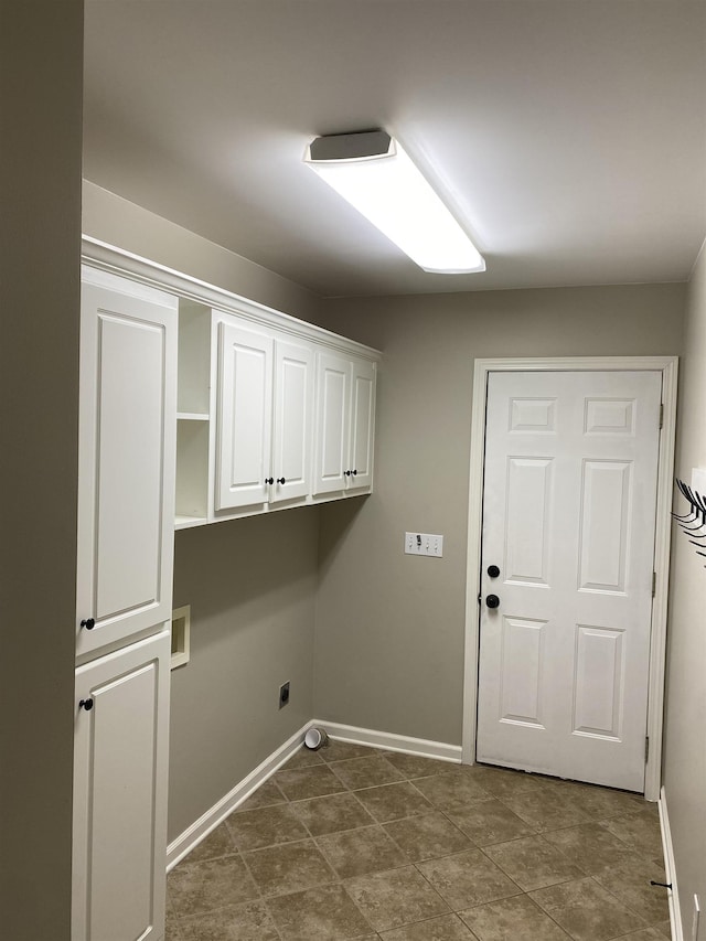 clothes washing area with cabinets and electric dryer hookup