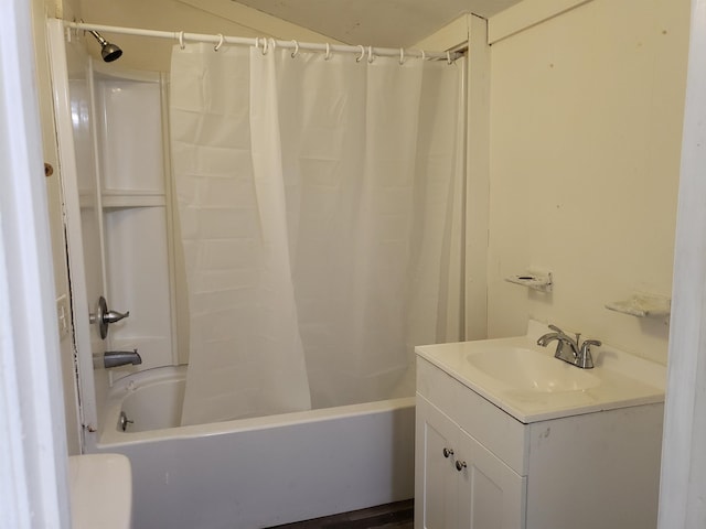 bathroom featuring shower / tub combo and vanity