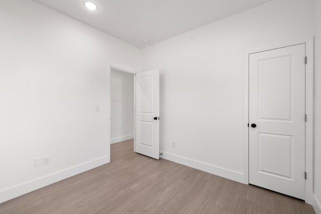 empty room with light hardwood / wood-style floors