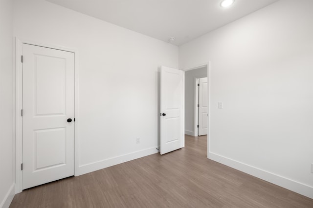 empty room with light hardwood / wood-style floors