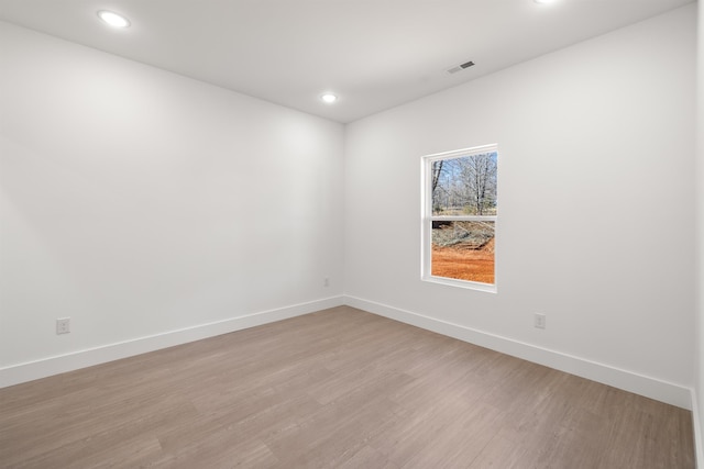 empty room featuring light hardwood / wood-style floors