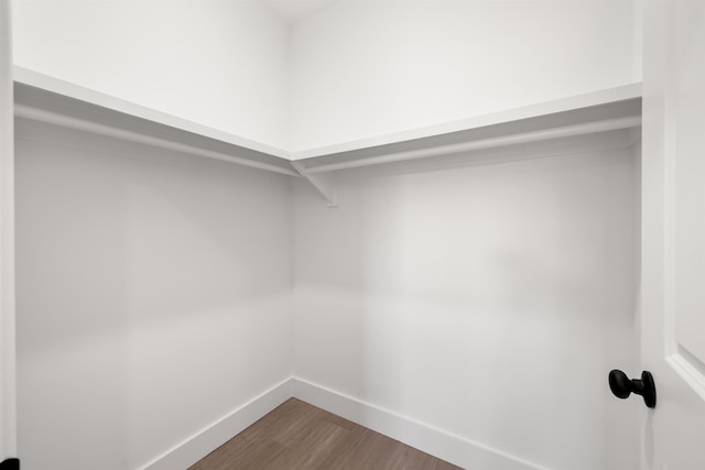 walk in closet featuring hardwood / wood-style floors