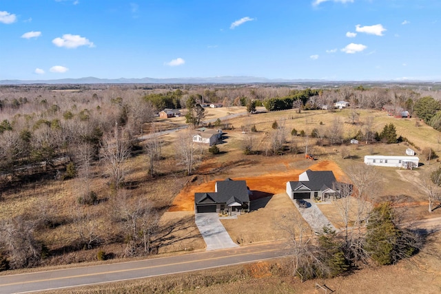 birds eye view of property with a rural view and a mountain view