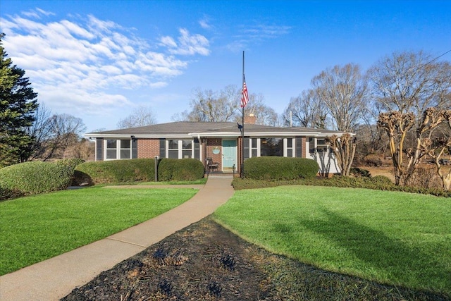 ranch-style home with a front yard