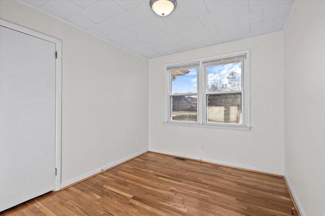 unfurnished room featuring hardwood / wood-style floors