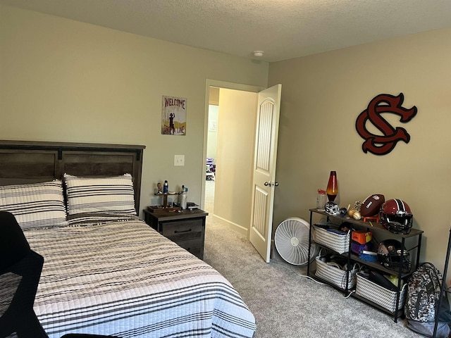 carpeted bedroom with a textured ceiling