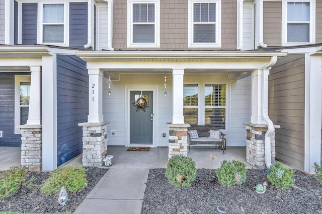 doorway to property with covered porch