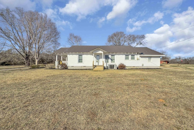 view of front of home with cooling unit and a front lawn