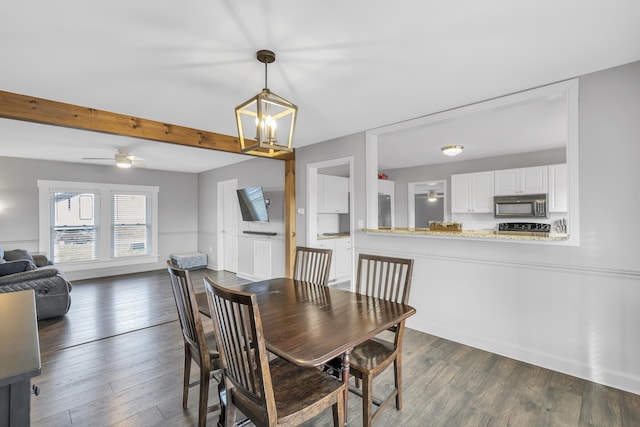 dining area with ceiling fan with notable chandelier, dark wood-type flooring, and beam ceiling