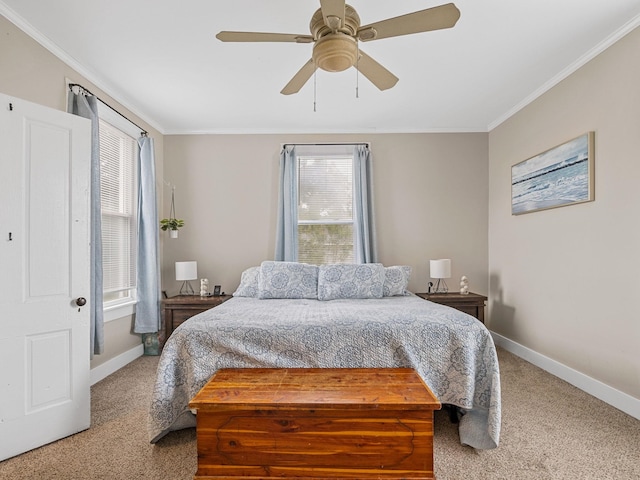 carpeted bedroom with ceiling fan and ornamental molding