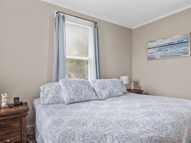 bedroom with ornamental molding