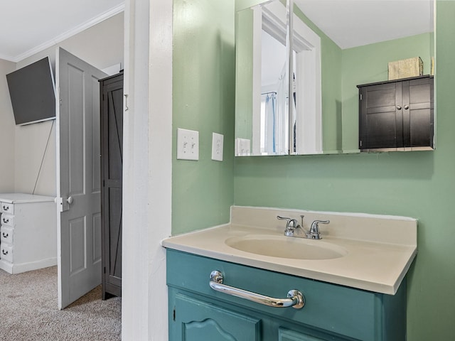 bathroom featuring vanity and ornamental molding