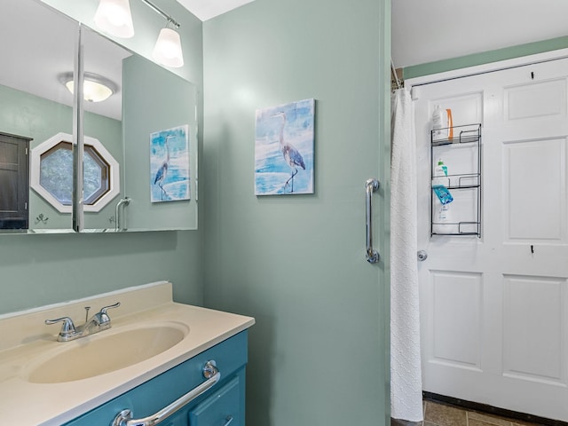 bathroom with tile patterned floors and vanity