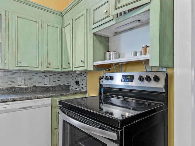 kitchen with stainless steel range with electric stovetop, white dishwasher, green cabinets, and decorative backsplash