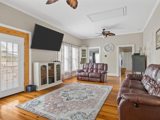 living room featuring wood-type flooring and ornamental molding