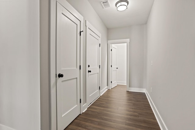 hallway featuring dark hardwood / wood-style floors