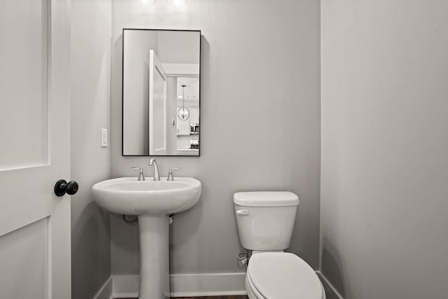 bathroom with sink and toilet