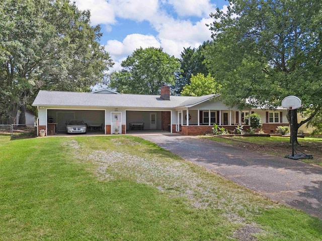 ranch-style home with a front yard and covered porch