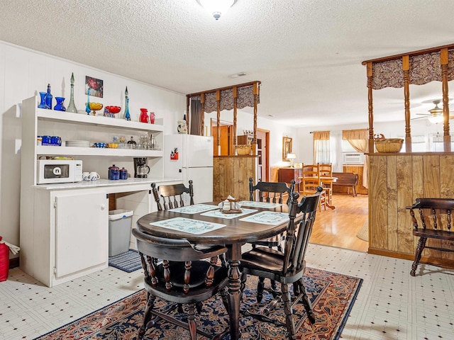 dining area with a textured ceiling