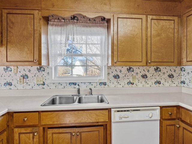 kitchen featuring white dishwasher and sink