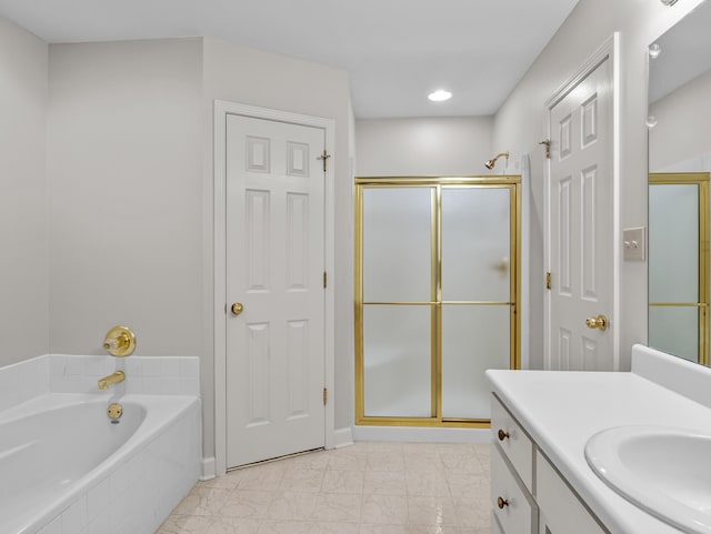 bathroom featuring vanity and separate shower and tub