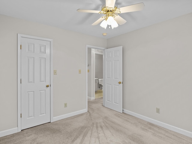 unfurnished bedroom featuring light carpet and ceiling fan