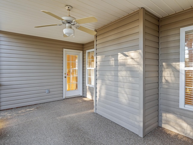 exterior space with wooden ceiling and ceiling fan