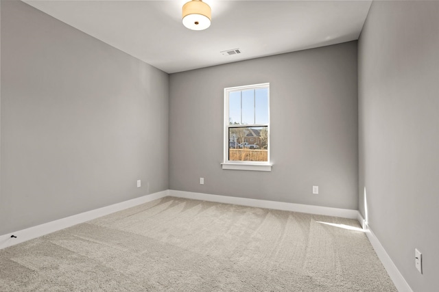 spare room featuring carpet floors