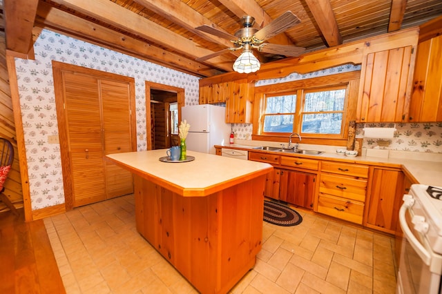 kitchen featuring white appliances, a center island, beam ceiling, ceiling fan, and sink