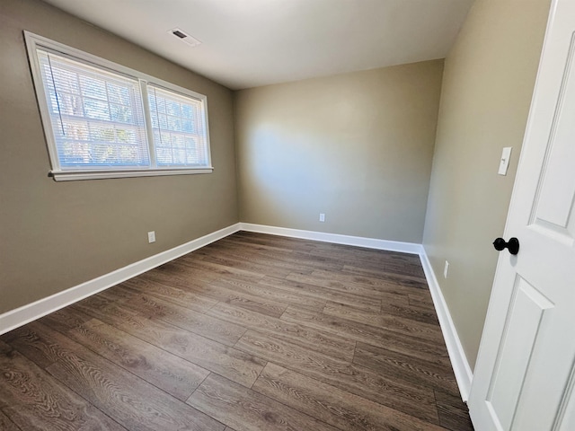 spare room with wood-type flooring