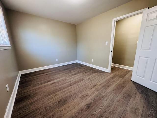 empty room with wood-type flooring