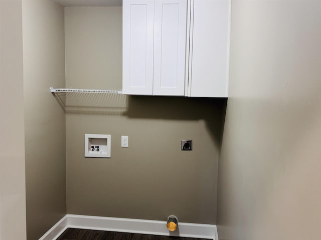 washroom featuring electric dryer hookup, hookup for a washing machine, cabinets, and dark hardwood / wood-style flooring