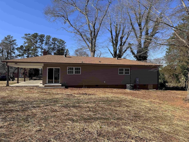 rear view of house with a patio area and central AC