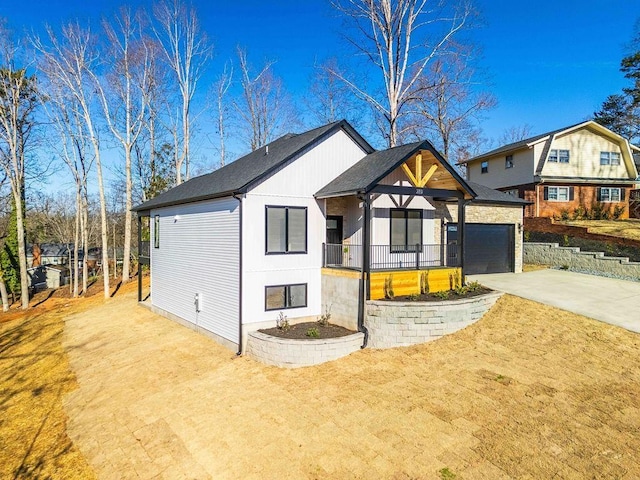 view of front of house with a garage and a front yard