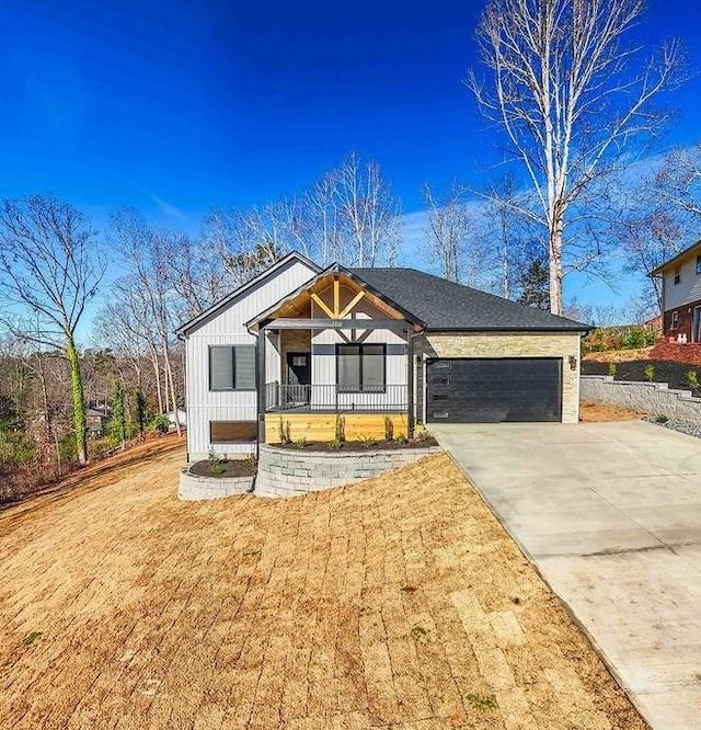 view of front of house with a garage and a porch