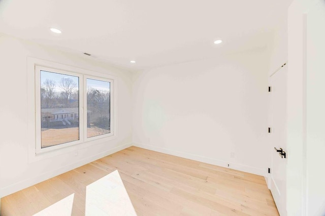 unfurnished room featuring light hardwood / wood-style flooring