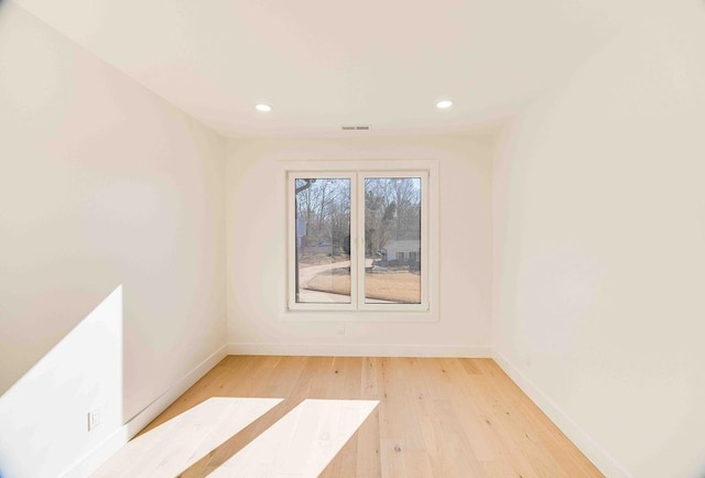 unfurnished room featuring light hardwood / wood-style floors