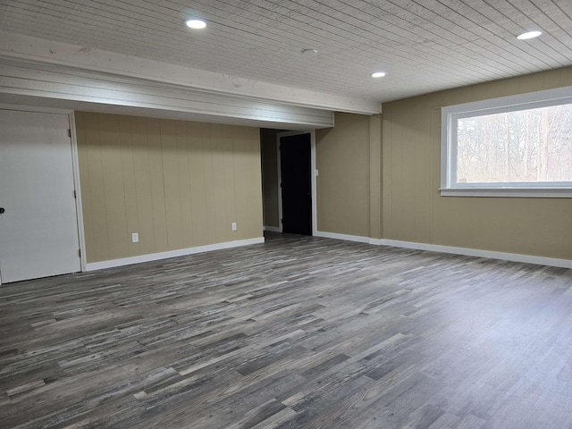 below grade area featuring baseboards, recessed lighting, wood ceiling, and dark wood finished floors