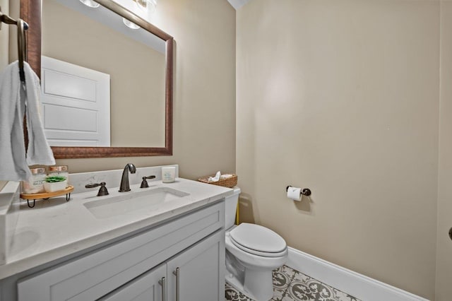 bathroom featuring tile patterned floors, toilet, and vanity