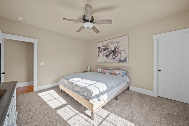 carpeted bedroom featuring ceiling fan